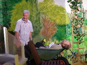 Vicar in wheelbarrow